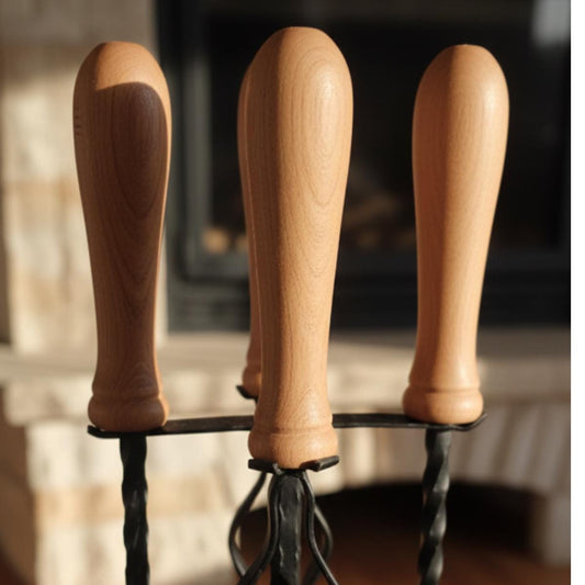 Traditional fireplace tools set with wood handle and metal stand for hearth use