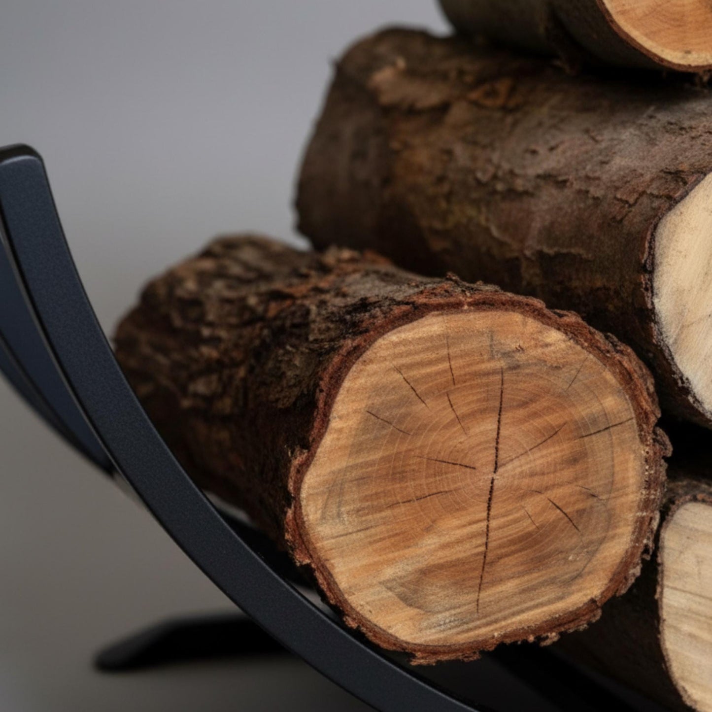 Compact round firewood holder ideal for small spaces and efficient indoor log storage near fireplace
