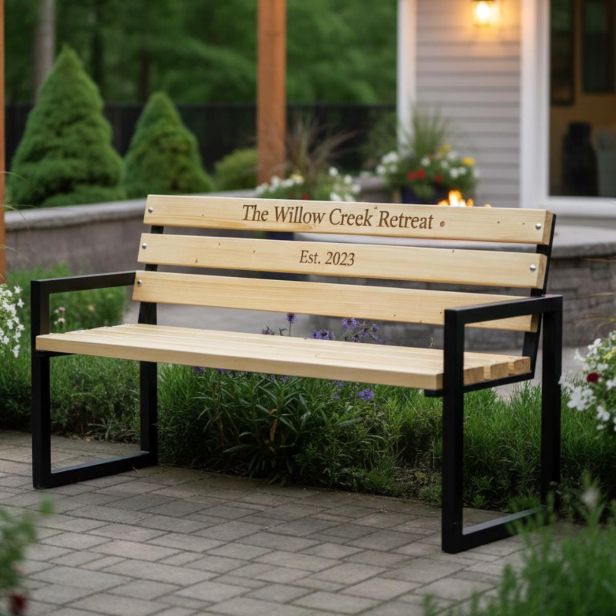 Custom engraved bench with wood slats and metal frame for outdoor garden use
