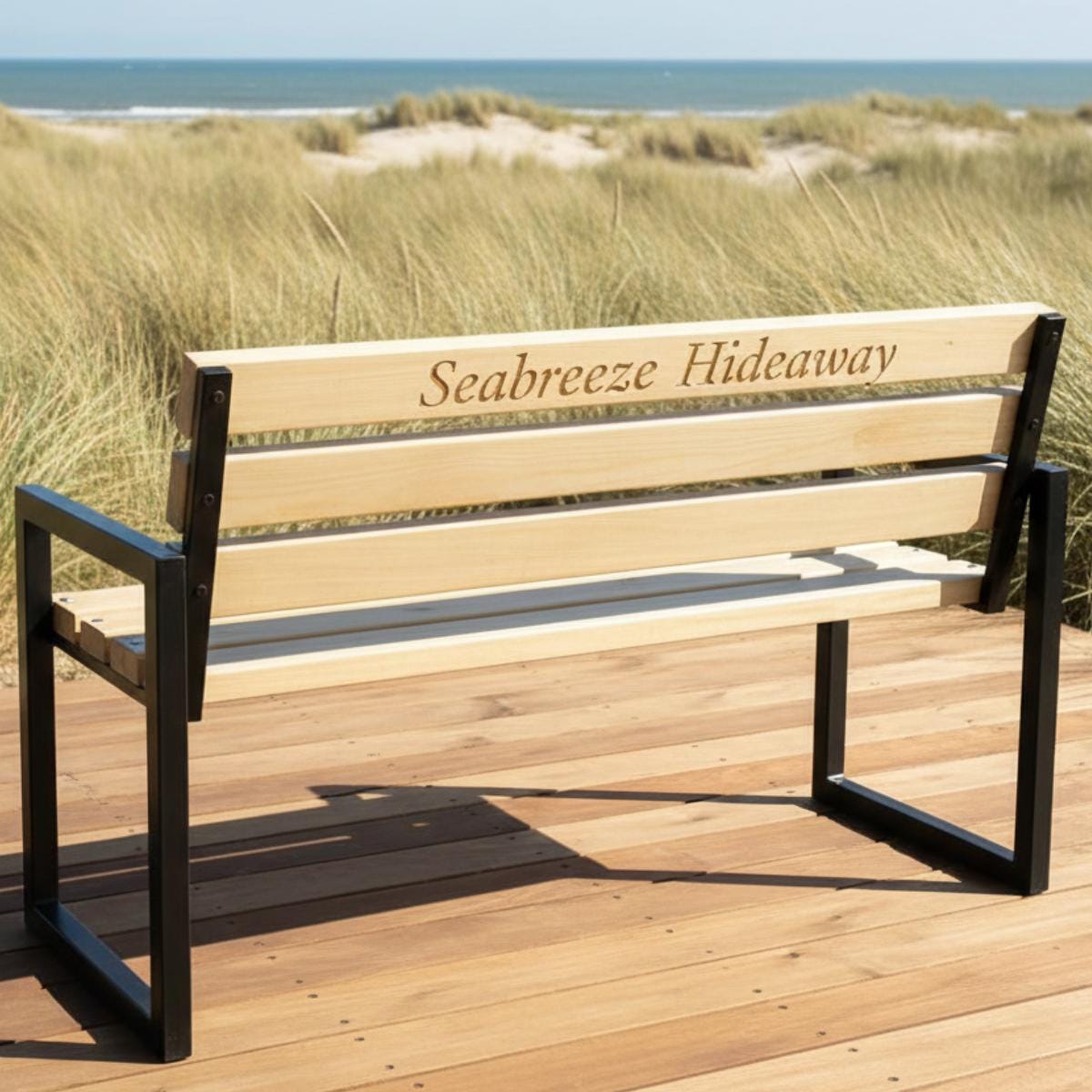 Engraved garden bench with wood slats and metal frame used as memorial seating
