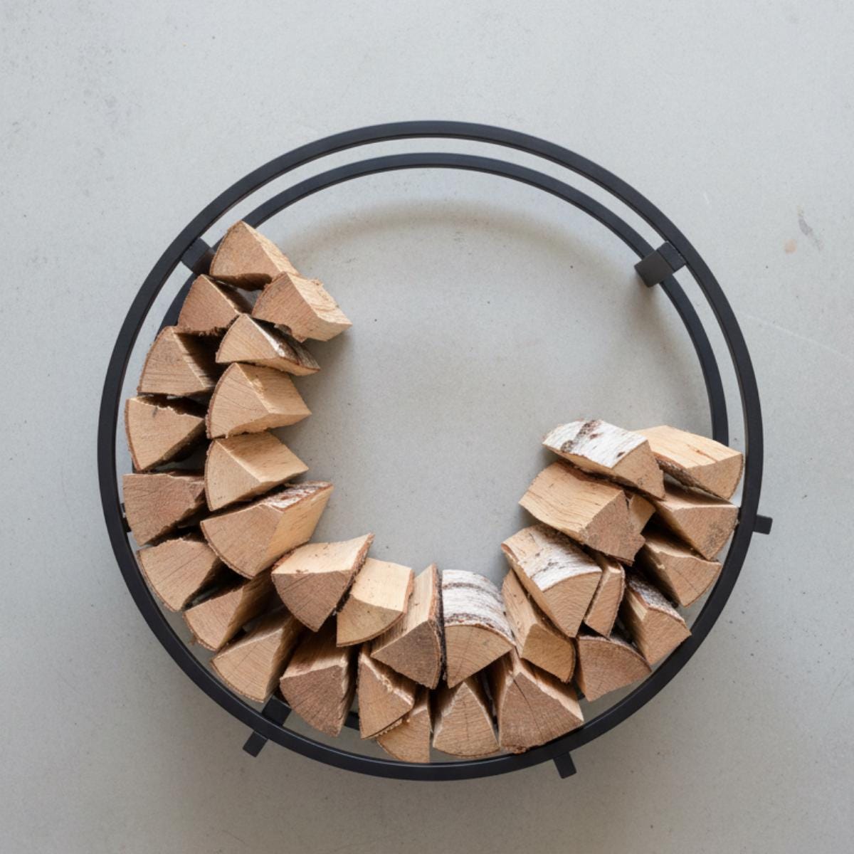 Fireplace firewood rack round metal log holder placed beside modern fireplace
