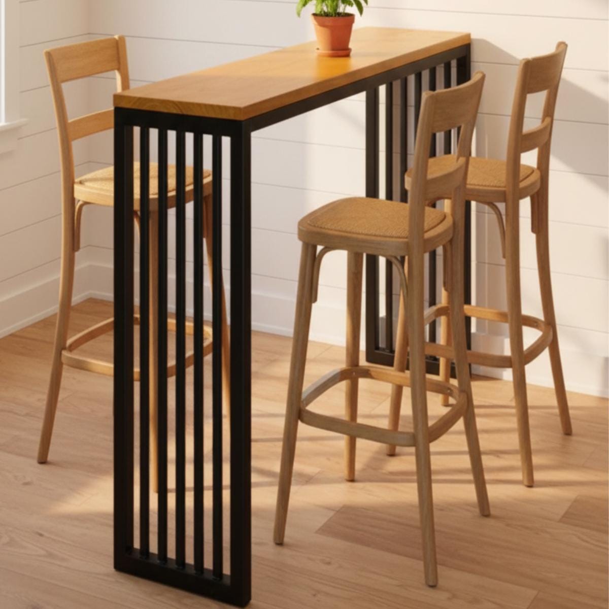 High top table with metal base and wood surface used in kitchen island setting