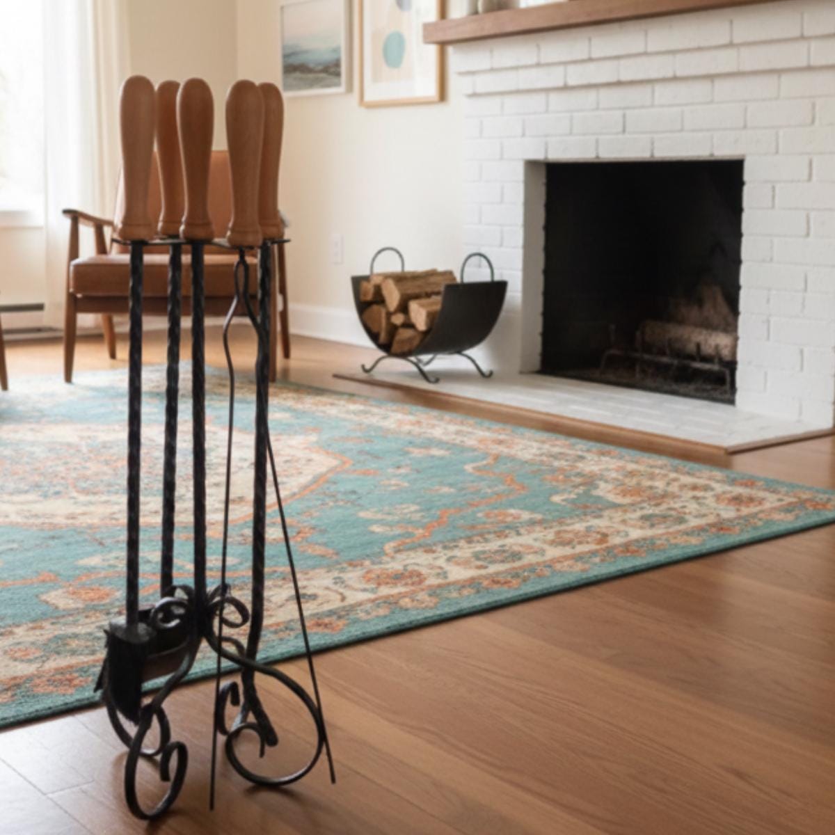 Indoor fireplace tools set with wood handle and metal stand in living room