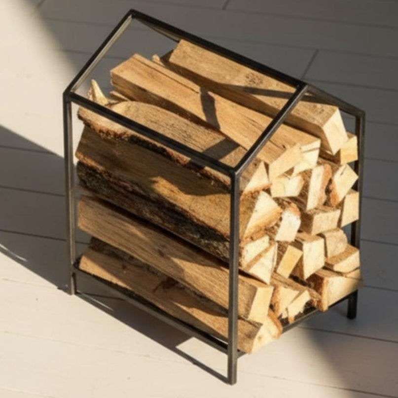 Indoor firewood rack functioning as practical fireplace accessory in modern home