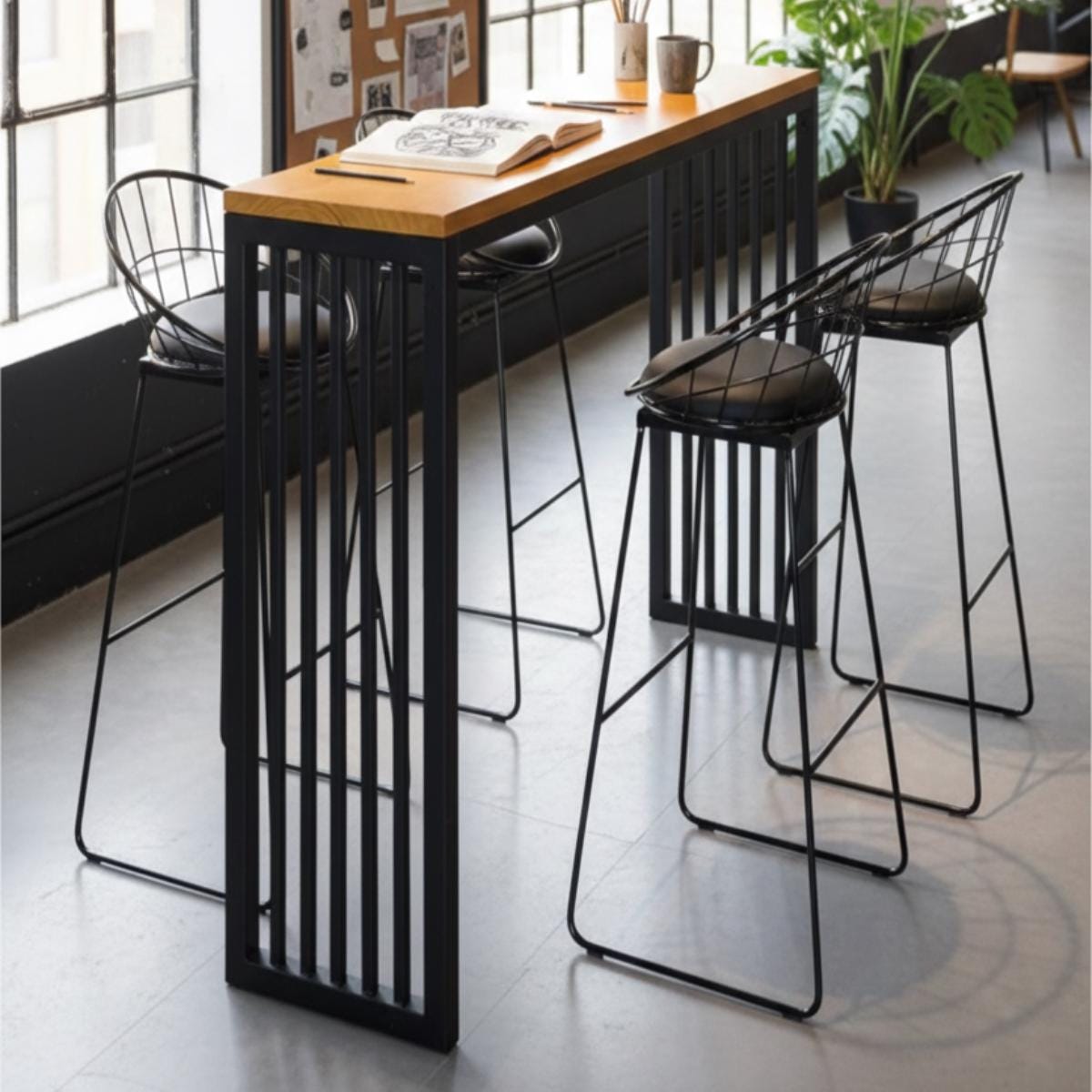Kitchen island bar table with metal frame and wood top in modern interior