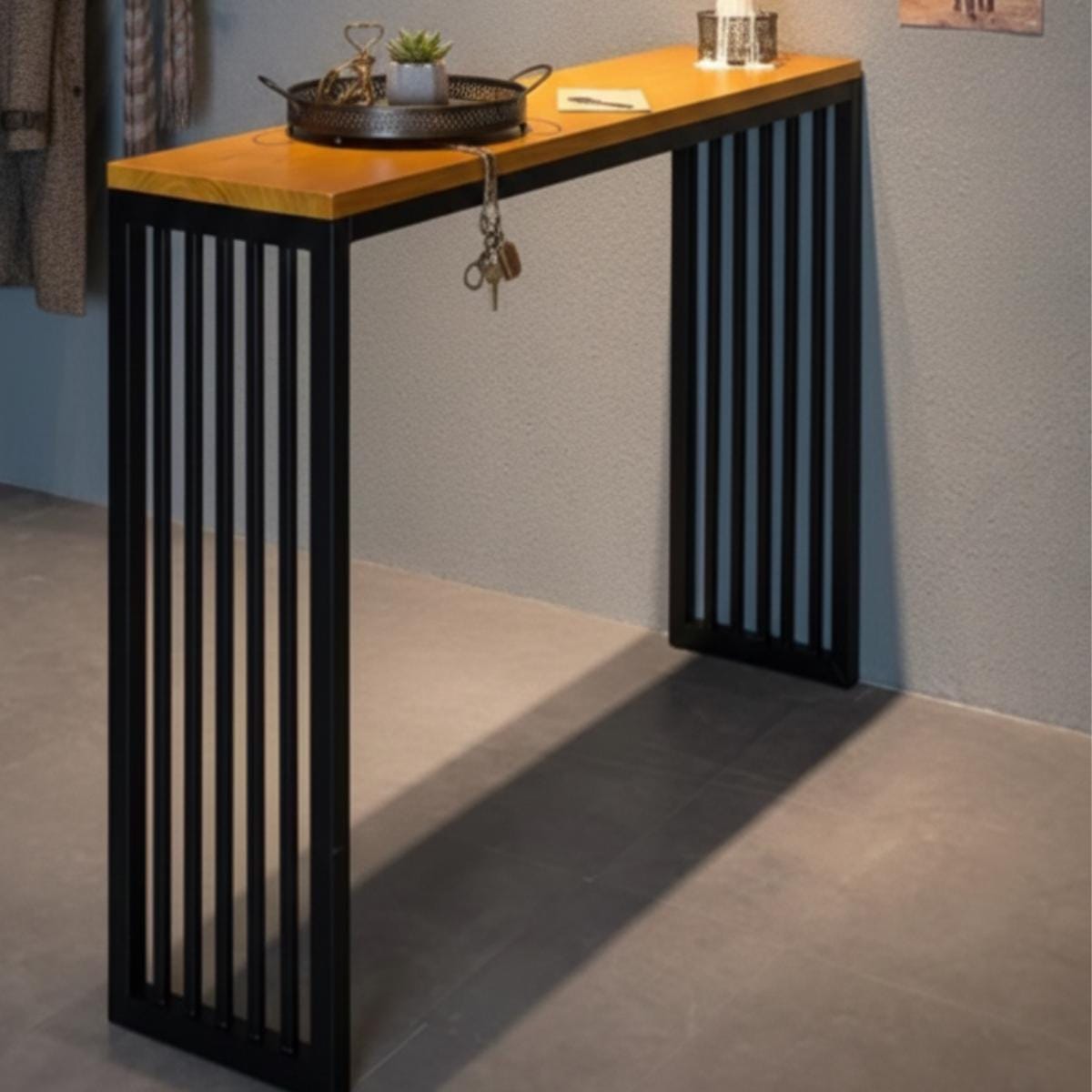 Modern bar table with stools featuring metal frame and wood top design