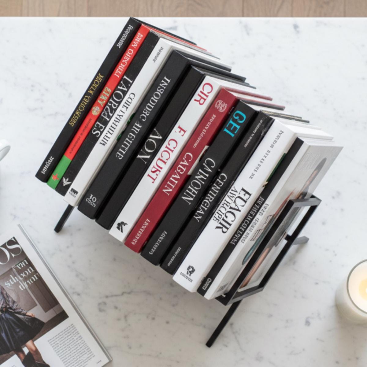 Modern vinyl record stand used as LP organizer with stacked records in stylish setting