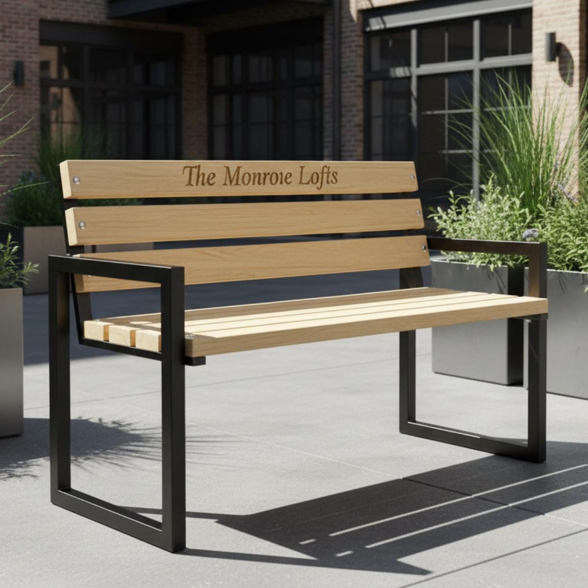 Personalized bench with engraved wood slats and metal frame for outdoor seating