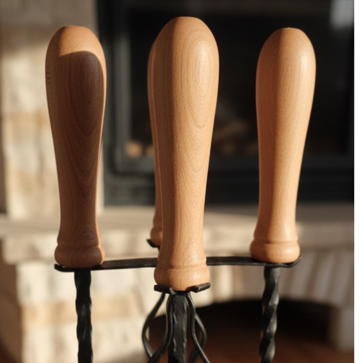 Traditional fireplace tools set with wood handle and metal stand for hearth use