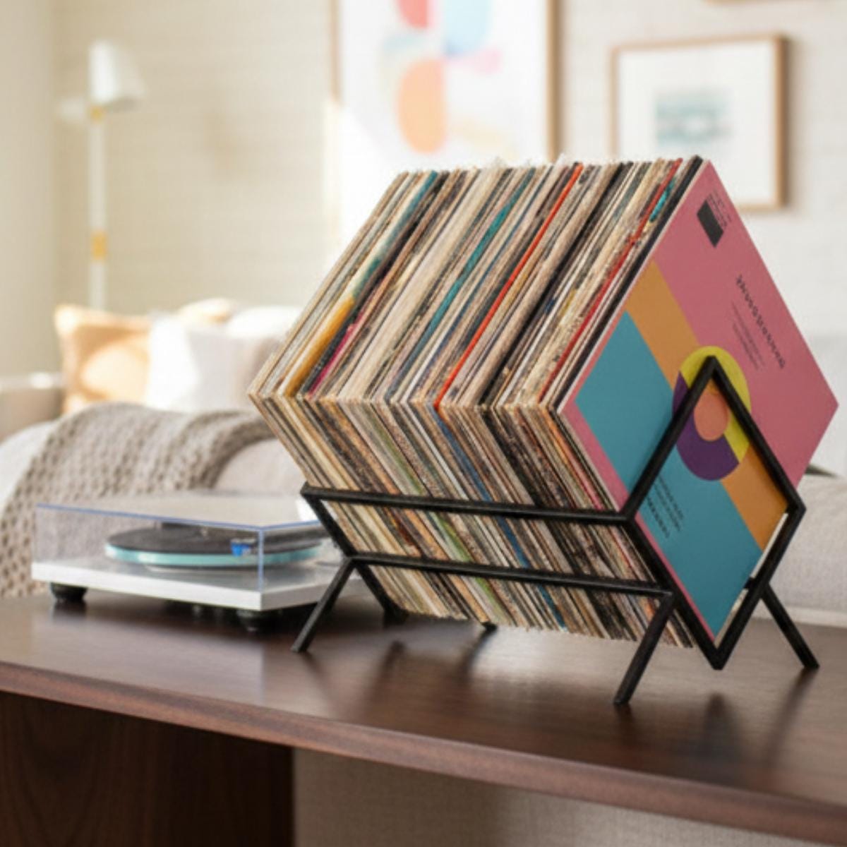 Vinyl record holder metal LP storage rack placed on table in modern home interior
